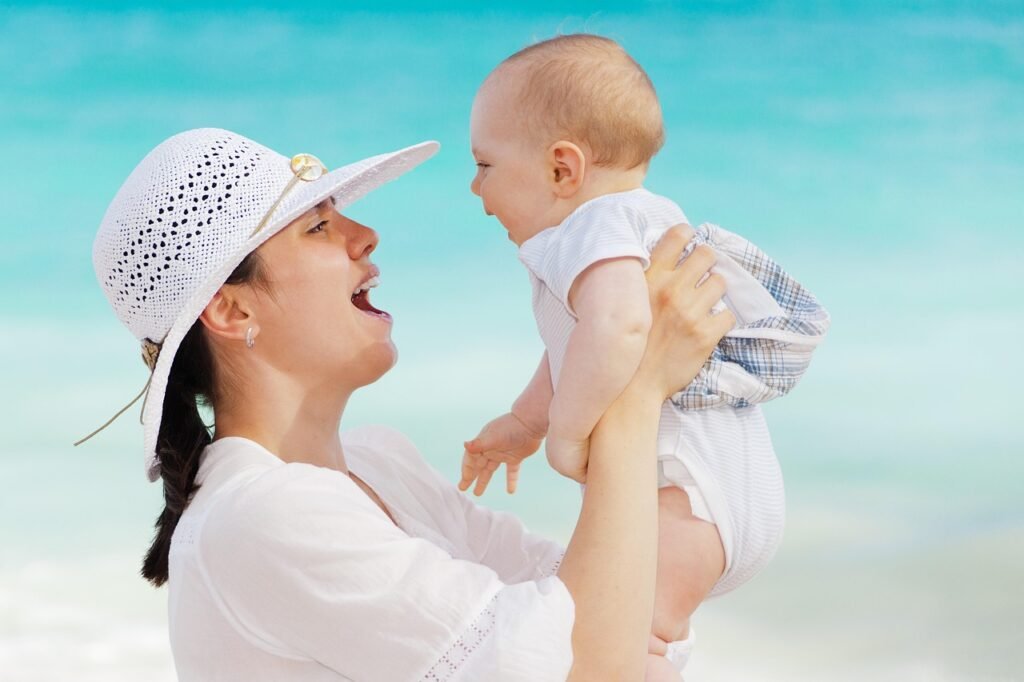 mother, baby, happy, motherhood, toddler, beach, outdoors, smiling, summer, people, nature, sea, woman, child, joy, vacation, mom